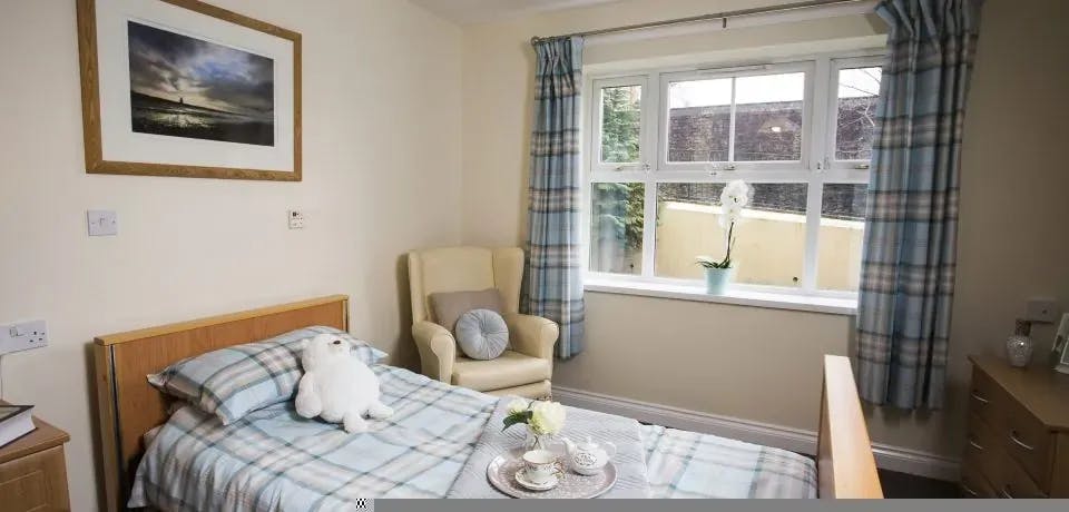 Bedroom of Ty Porth care home in Porth, Wales