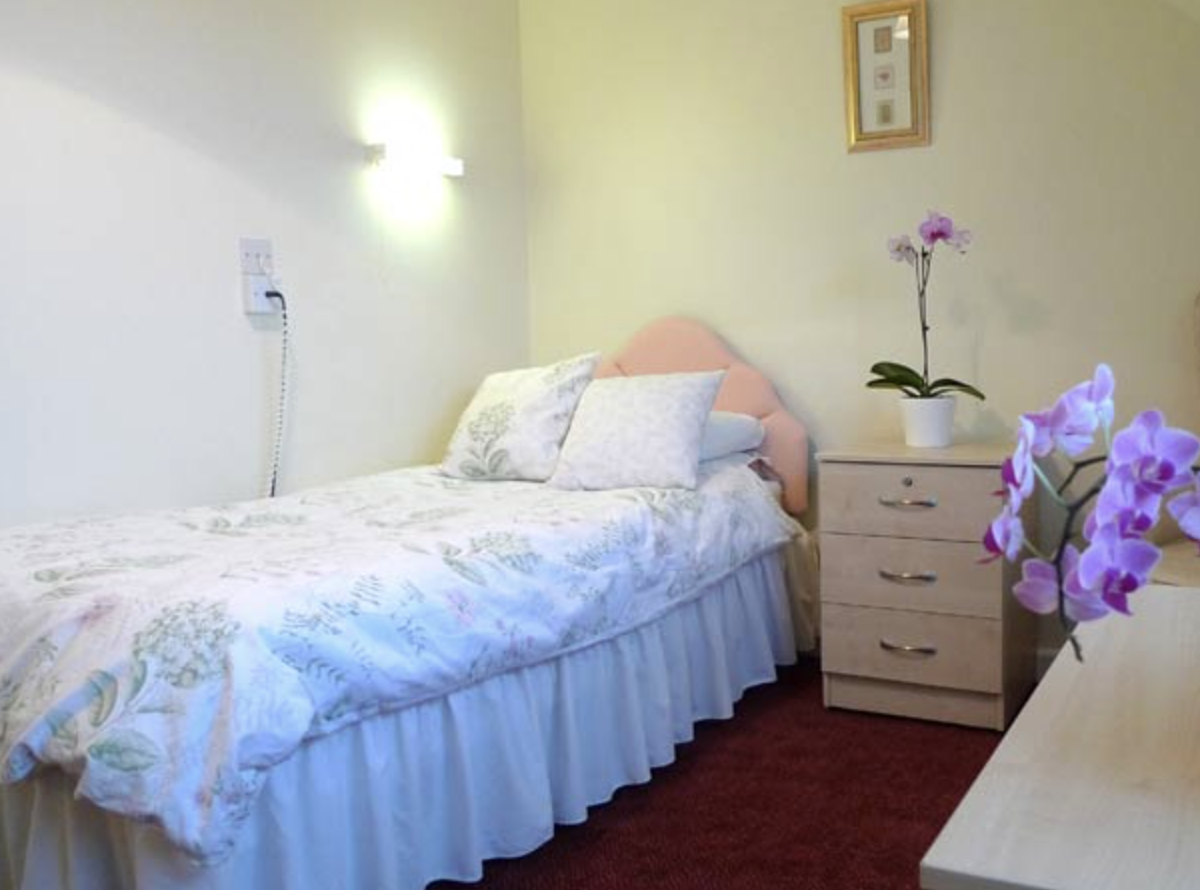 Bedroom of The Newton Grange care home in Langland, Wales