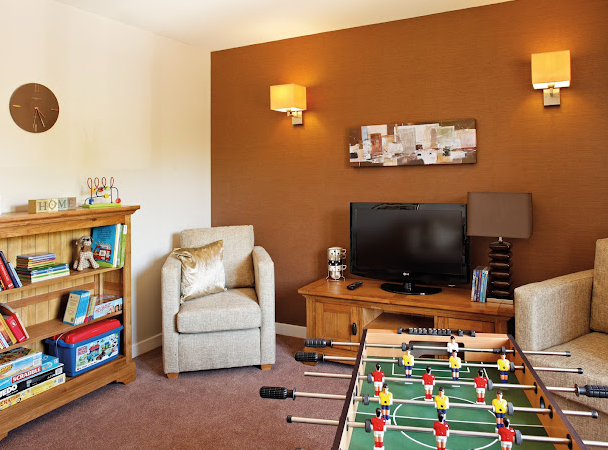 Games room of Warren Lodge care home in Ashford, Kent