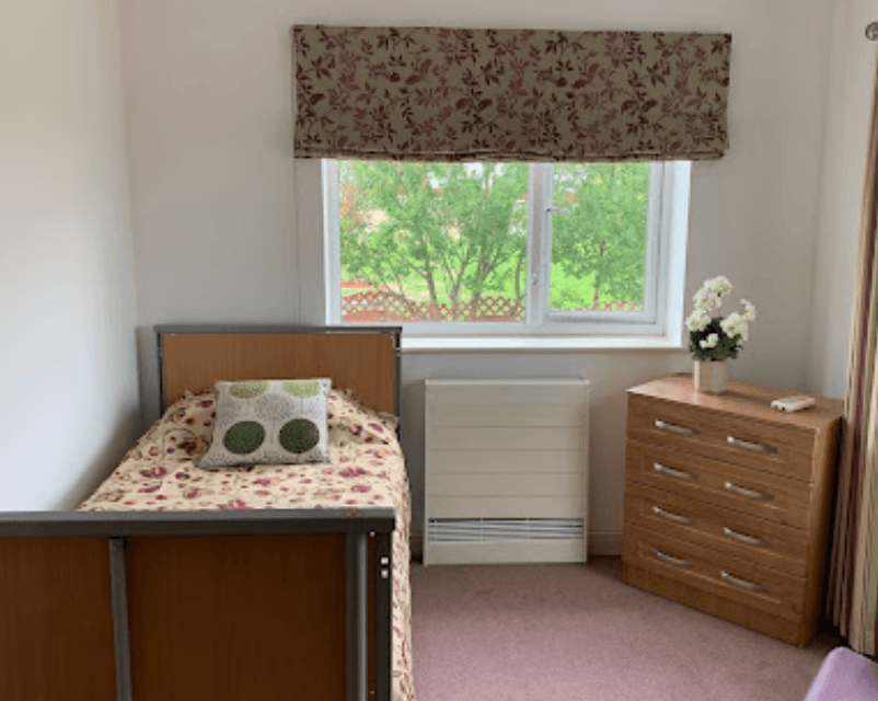 Bedroom of Woodheath care home in Upton, Wirral