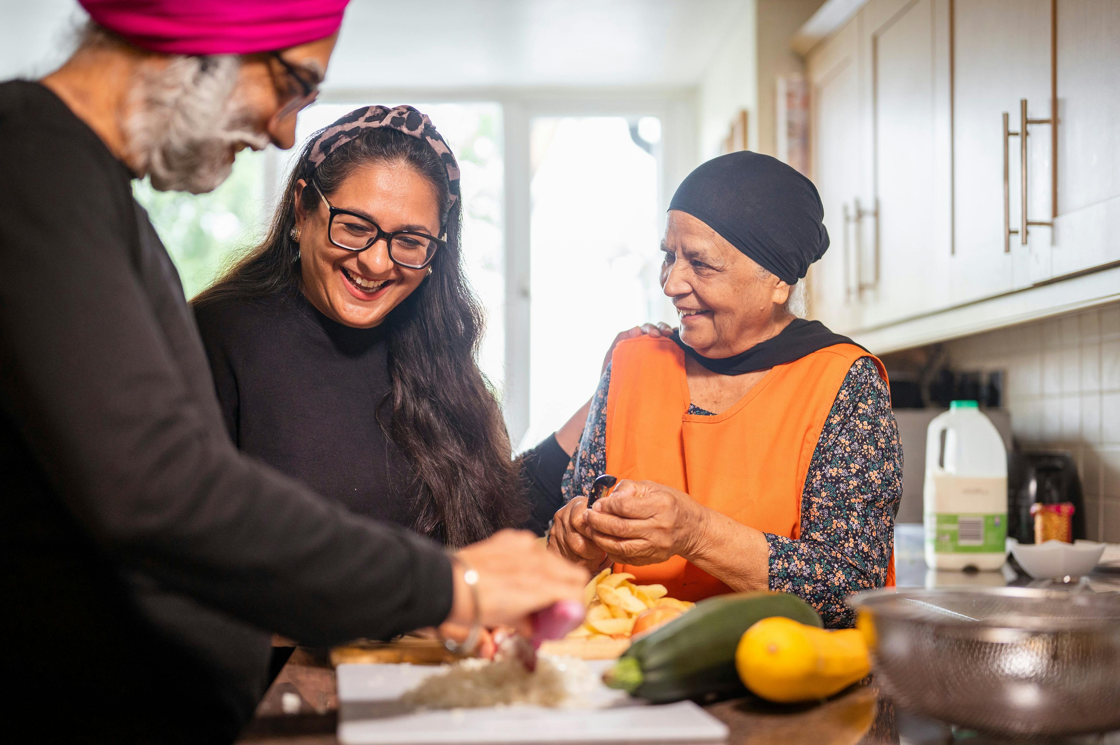 Woman helping elderly couple with their food and nutrition