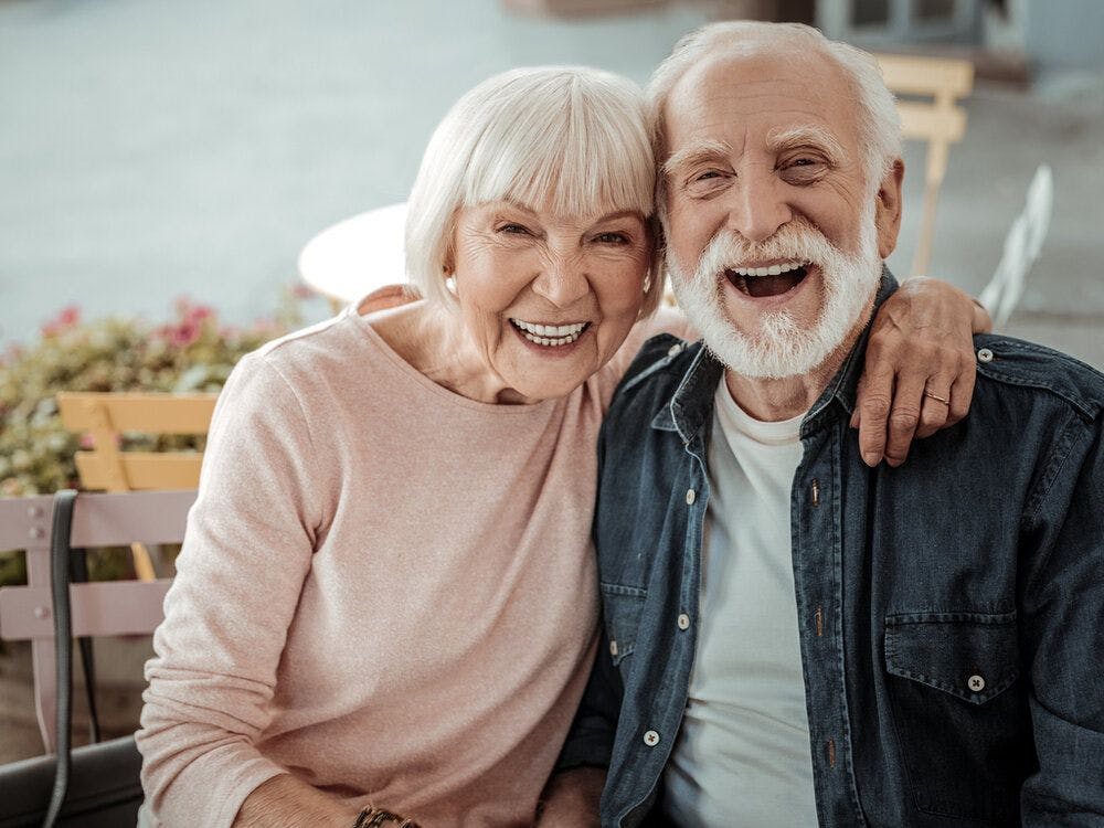 An old couple smiling
